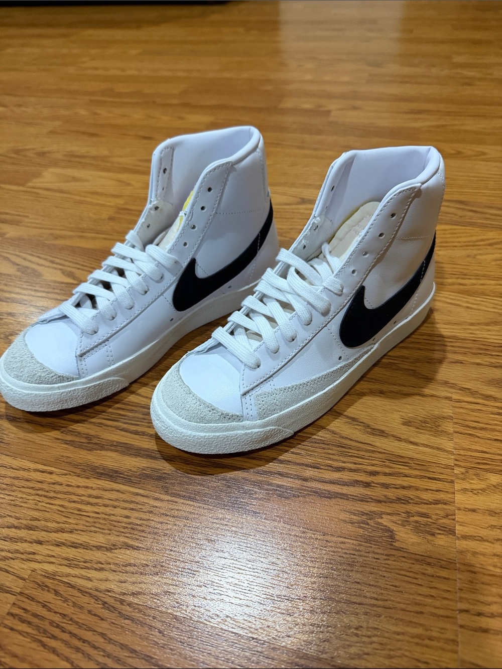 NWOT Nike White High-Top Sneakers with Black Swoosh